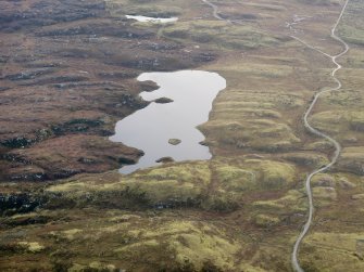 Oblique aerial view of the remains of Dun Loch an Duna, Isle of Lewis, taken from the NNW.