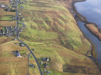 Oblique aerial view of the remains of  Leurbost township, with associated head dyke, field system and lazy beds, Isle of Lewis, taken from the WNW.