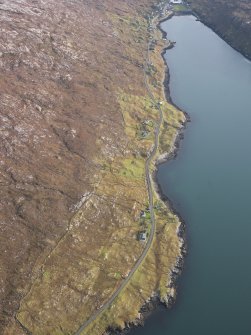 General oblique aerial view of the remains of the townships of Lechcan, West Tarbert and Tota Glas, with associated head dyke and piers on the shores of Loch a' Siar, Harris, taken from the NW.