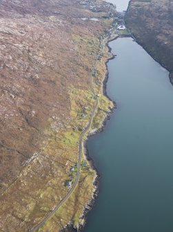 General oblique aerial view of the remains of the townships of Lechcan, West Tarbert and Tota Glas, with associated head dyke and piers on the shores of Loch a' Siar, looking towards Tarbert, Harris, taken from the NW.