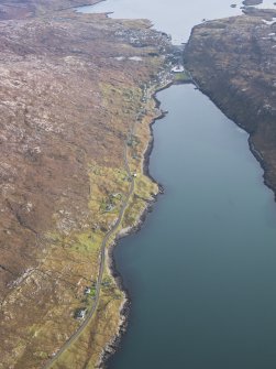 General oblique aerial view of the remains of the townships of Lechcan, West Tarbert and Tota Glas, with associated head dyke and piers on the shores of Loch a' Siar, looking towards the village of Tarbert, Harris, taken from the NW.