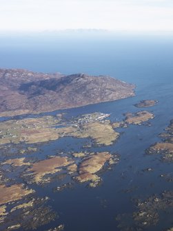 General oblique aerial view of the possible remains of a monastic settlement on Pabbay, Loch Baghasdal, looking towards Loch Boisdale, taken from the SW.