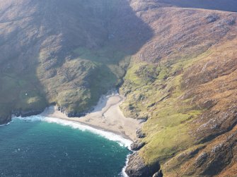 Oblique aerial view of the remains of the township and field system at Mingulay Bay, Mingulay, taken from the E.