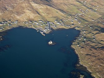 General oblique aerial view of the remains of Kiessimul Castle,Castlebay, Barra, taken from the SSW.