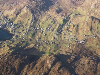 Oblique aerial view of the remains of the townships and field systems at Castlebay, Glenlots and The Glen, Castlebay, Barra, taken from the SSE.