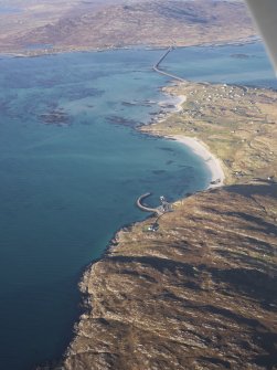 General oblique aerial view of the remains of the field systems and cultivation remains at Coileag and Balla, near the Coileag jetty, looking towards the Eriskay causeway, taken from the S.