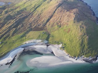 Oblique aerial view of the remains of the township of Ruisgarry, the Berneray Parliamentary Church Manse, and the nearby lazy beds on Berneray, Harris, taken from the ESE.