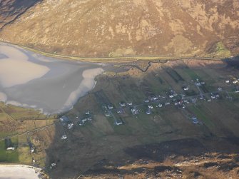 Oblique aerial view of the remains of the township, field system, lazy beds and fish trap at Northton, Harris, taken from the SW.