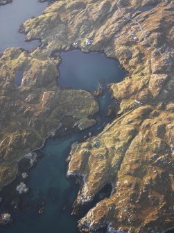 Oblique aerial view of the remains of the townships of Manish and Ardslave, with nearby remains of a head dyke, enclosures and lazy beds, Harris, taken from the E.