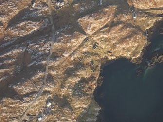 Oblique aerial view of the remains of the eastern end of the township of Manish including the possible remains of a horizontal mill, with nearby remains of lazy beds, Harris, taken from the WSW.