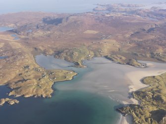 General oblique aerial view of Crowlista and Dun Borranish centred on Traigh Uige, taken from the SSW.