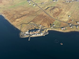 Oblique aerial view centred on the factory and jetty at Breascleit, taken from the S.