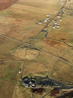 General oblique aerial view centred on the stone circle and stone row, the remains of the buildings and lazy beds at Calanais with the visitor centre in the foreground, taken from the S.