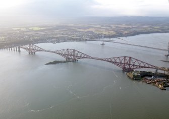 General oblique aerial view of the River Forth centred on the Forth Railway Bridge, taken from the NE.