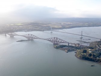 General oblique aerial view of the River Forth centred on the Forth Railway Bridge, taken from the NE.