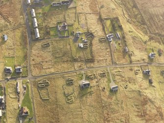 Oblique aerial view of the buildings at Arnol, taken from the N.