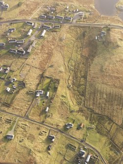 Oblique aerial view of the buildings at Arnol, taken from the NNW.
