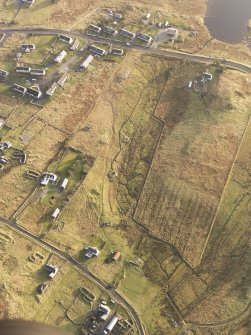 Oblique aerial view of the buildings at Arnol, taken from the NW.