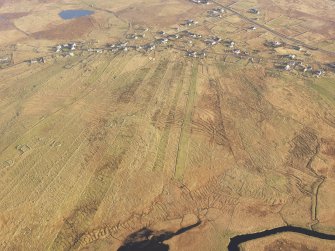 Oblique aerial view of the township of Arnol, taken from the NW.
