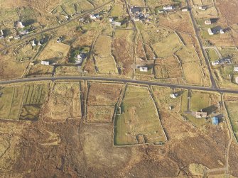 Oblique aerial view of the township of Arnol, taken from the SE.