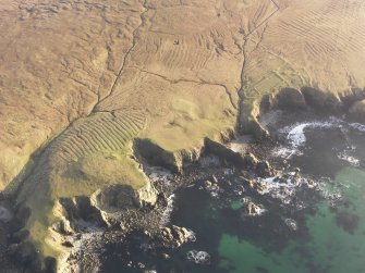 Oblique aerial view of the remains of the lazy beds and enclosures at Air Barvas, taken from the NW.