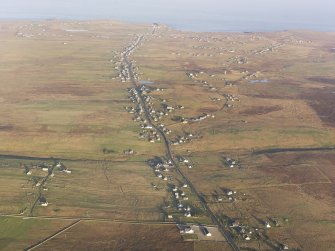 General oblique aerial view looking across the townships of Cros and Nis towards Port of Nis on the Isle of Lewis, taken from the WSW.