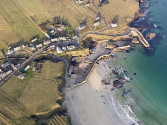 Oblique aerial view of Port of Ness, taken from the S.