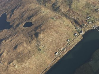Oblique aerial view of the remains of the township, field system and lazy beds at Gravir, Lewis, taken from the SW.