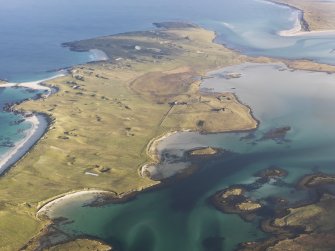 General oblique aerial view of the Isle of Vallay, looking from the location of the remains of fish traps at Moronish towards Vallay House, Vallay, North Uist, taken from the SW.