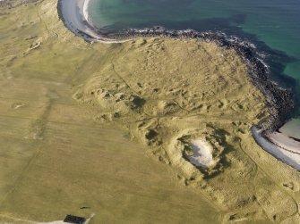 Oblique aerial view of the remains of the settlement at the Udal, North Uist, taken from the E.