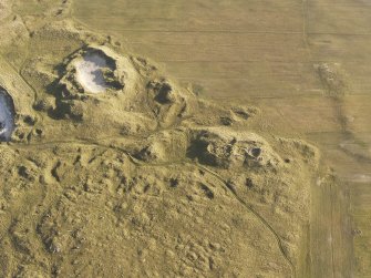 Oblique aerial view of the remains of the settlement at the Udal, North Uist, taken from the W.