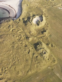 Oblique aerial view of the remains of the settlement at the Udal, North Uist, taken from the SW.