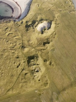 Oblique aerial view of the remains of the settlement at the Udal, North Uist, taken from the SSW.