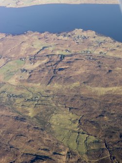 General oblique aerial view of the remains of the townships of Clachamish and Treaslane and the nearby remains of field systems and lazy beds, Skye, taken from the SW.