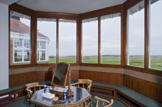 Interior.  View from within the bay window of the mens locker room of Muirfield clubhouse, looking out to the course.