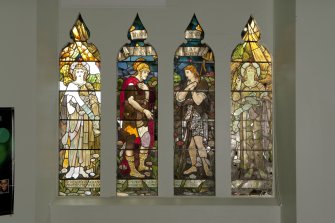 Interior. View of four panelled stained glass window on west wall.