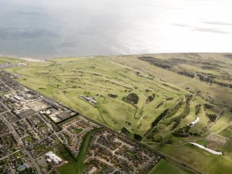 Oblique aerial view of Carnoustie Golf Courses, taken from the NW.