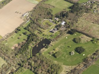 Oblique aerial view of Guthrie Castle Golf Course, taken from the SW.