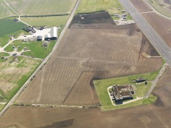 Oblique aerial view of the soilmarks of the rig and furrow at Edzell Airfield, taken from the NW.