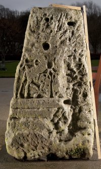 View of carved face of cross base (flash, with scale)