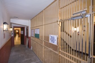 Interior. Basement. Passage and grille.