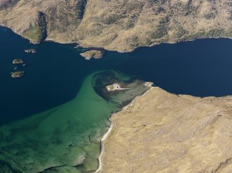Oblique aerial view of the remains of a fish trap at Eilean Choinnich  near Camas Liathach on the S side of Loch Hourn,   taken from the SSE.