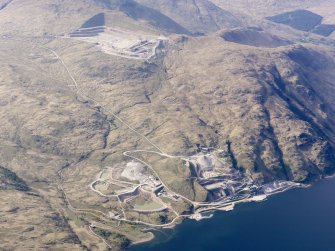 General oblique aerial view of Glensanda-Meall na h-Easaiche and Glensanda quarries, and the remains of Glensanda castle, farmstead and field systems, taken from the SSE.