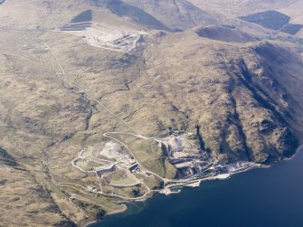 General oblique aerial view of Glensanda-Meall na h-Easaiche and Glensanda quarries, and the remains of Glensanda castle, farmstead and field systems, taken from the SSE.