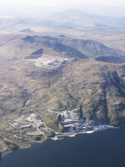 General oblique aerial view of Glensanda-Meall na h-Easaiche and Glensanda quarries, and the remains of Glensanda castle, farmstead and field systems, taken from the SE.