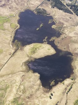 General oblique aerial view of Loch Tromlee and the remains of the buildings, taken from the N.