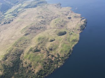 General oblique aerial view of the remains of the field boundaries and buildings, taken from the NE.