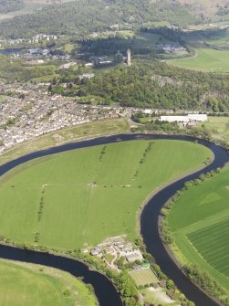 General oblique aerial view of the Wallace Monument and Stirling looking across a loop in the River Forth, taken from the SW.