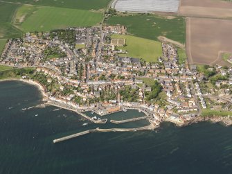 General oblique aerial view of Pittenweem centred on the harbours, taken from the S.