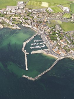General oblique aerial view of Anstruther centred on the harbour, taken from the SSE.